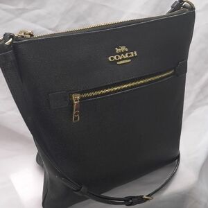 Coach Rowan File Black Leather Crossbody Bag with Gold Carriage Logo Detal.